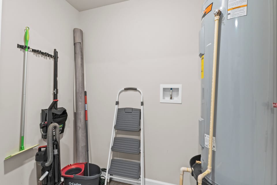 Vacuum and cleaning tools in utility closet 