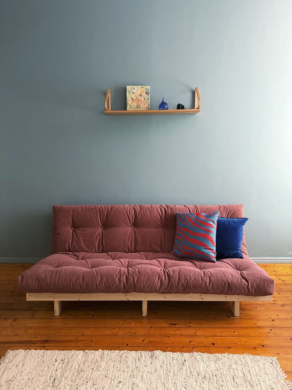 High-quality fold-out futon sofa.