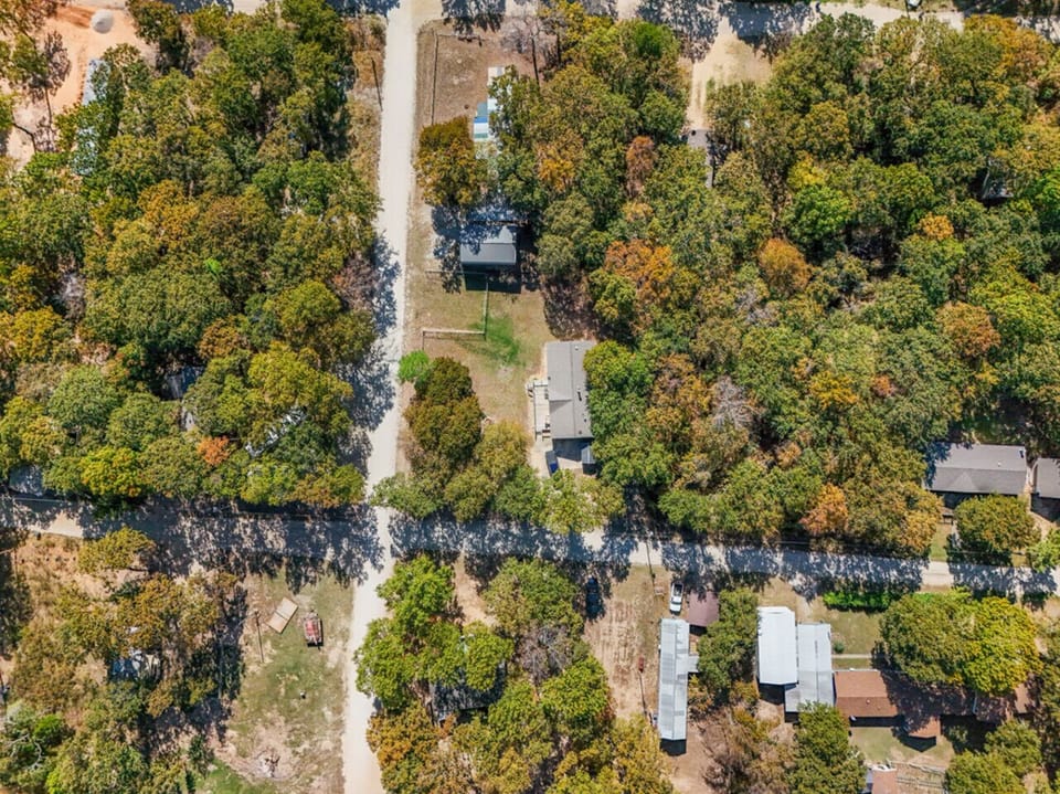 Aerial View | Serene Lakefront Surroundings | Peaceful Tree-Lined Neighborhood | Minutes from Waterfront Recreation
