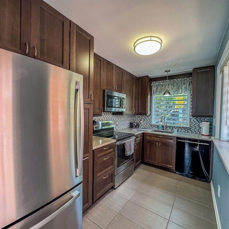 Full kitchen with dishwasher, oven, stove, microwave, coffee maker and fridge