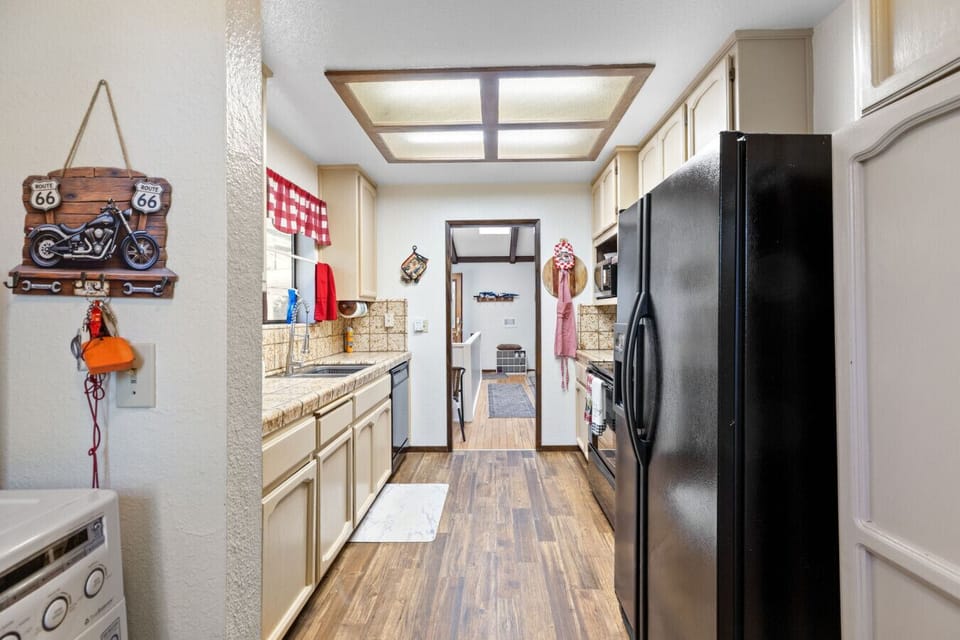 Kitchen | Black Refrigerator | Tile Countertop