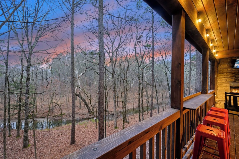 Hang out on the covered deck and take in the creek and forest view