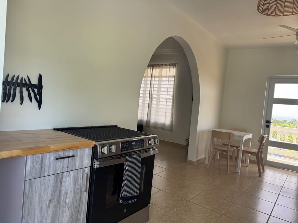 Fully stocked kitchen with stove, oven, blender, microwave, toaster, pots & pans