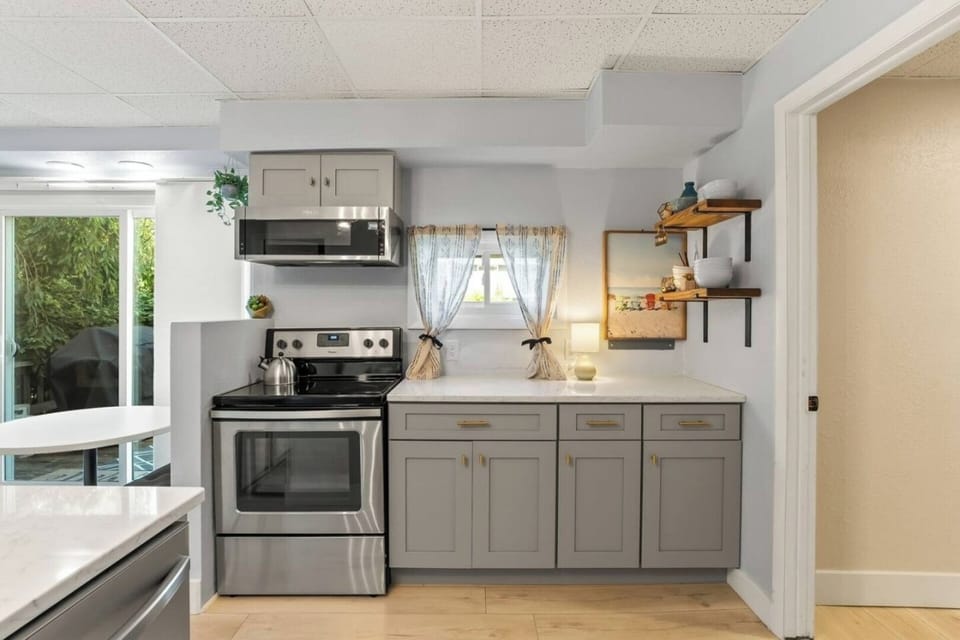 Prepare your favorite meals in this inviting kitchen, where space and style make cooking feel effortless.