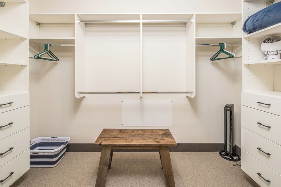 A large walk-in closet in the primary bedroom. | Main Level