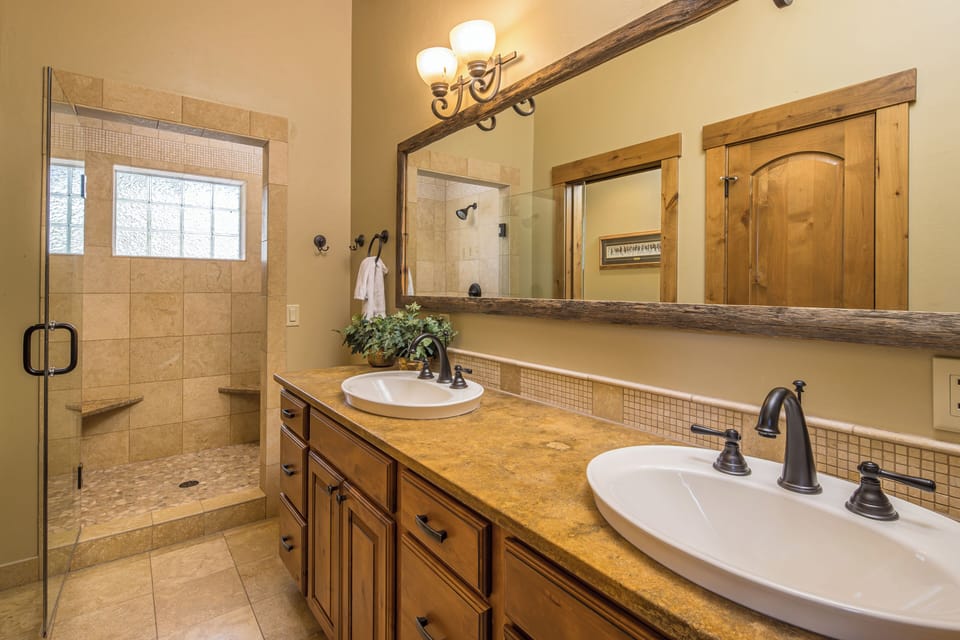Dual vanity sink with a large mirror, to ensure you and your partner are able to get ready together! | Upper Level