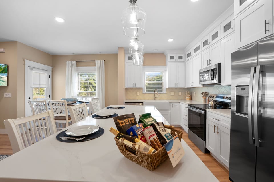 Featuring sleek finishes, top-quality appliances, a large kitchen island, and plenty of counter space.