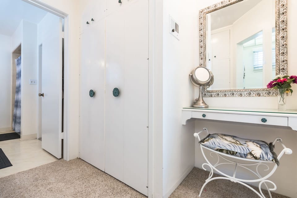 The dual-access bathroom is accessible from the primary suite and hallway, with a privacy door available to separate the two sides
                