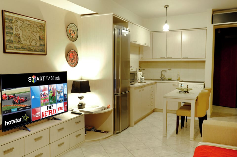 Apartment, City View | Living area | 50-inch Smart TV with cable channels, Netflix, streaming services
