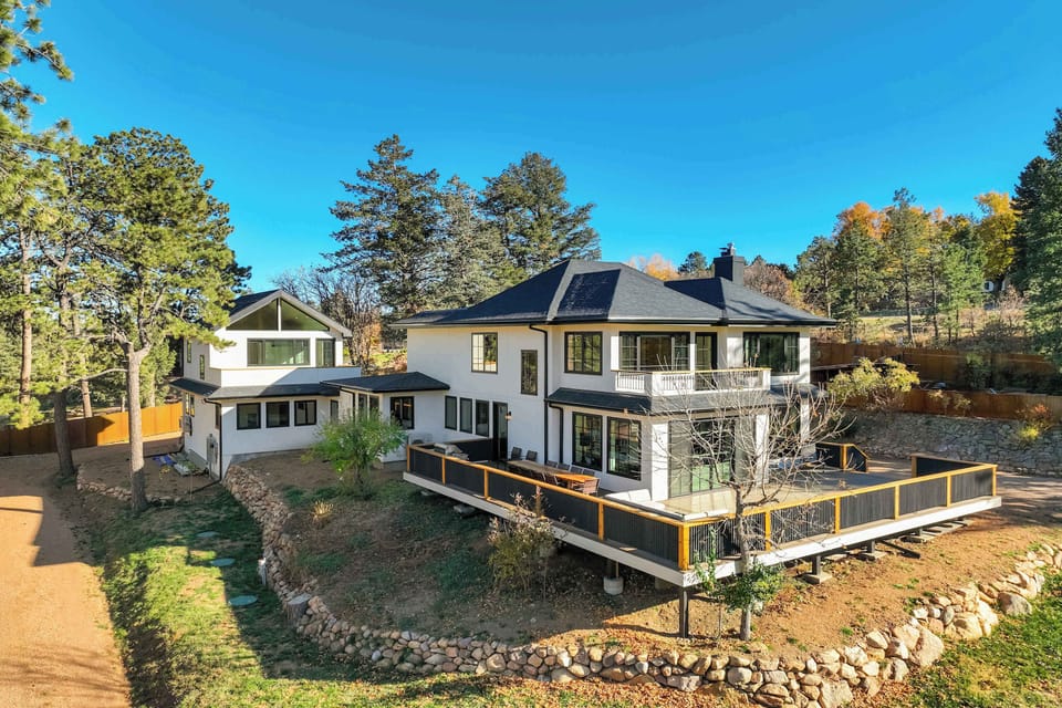Welcome to The Mesa House! Tucked among soaring pines near the Broadmoor, this newly built retreat offers a peaceful mountain escape with stunning natural scenery and modern design that feels instantly inviting.