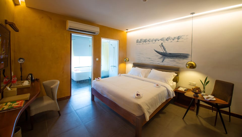 Deluxe Double - River View (Mekong) | Premium bedding, minibar, in-room safe, blackout drapes