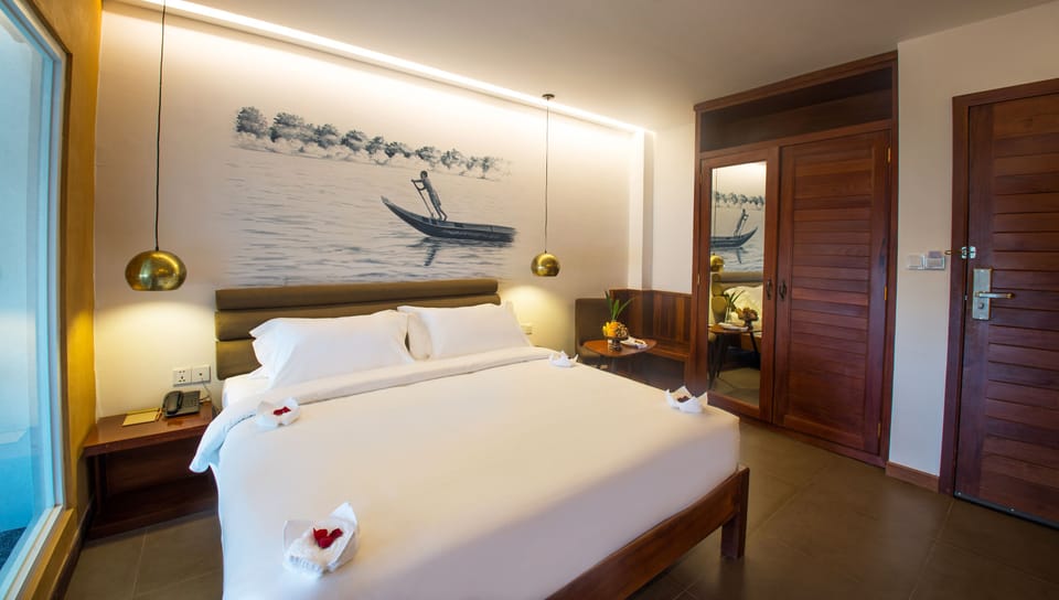 Deluxe Double - River View (Mekong) | Premium bedding, minibar, in-room safe, blackout drapes