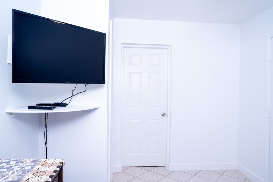Relax and enjoy your favorite shows on the large flat-screen TV.