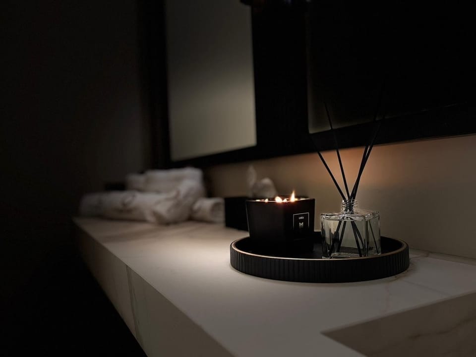 Luxury Suite, Balcony | Bathroom | Shower, hair dryer, slippers, towels