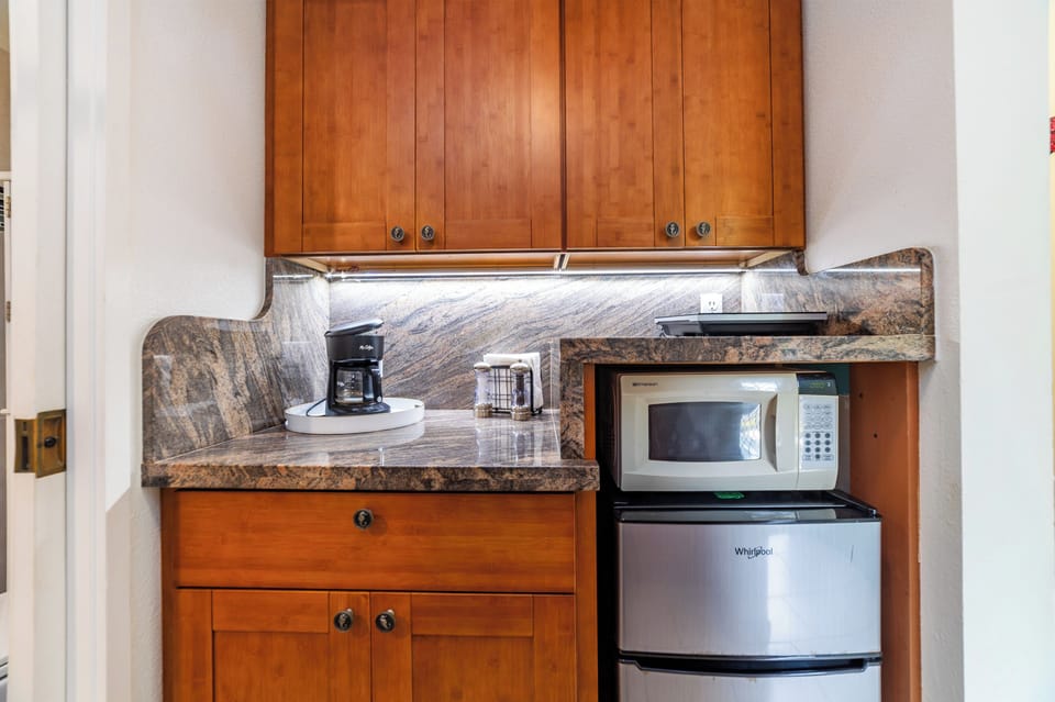 Your kitchenette is fully equipped with everything you need to prepare quick meals and snacks during your stay, including a mini-fridge, microwave, and coffee maker.