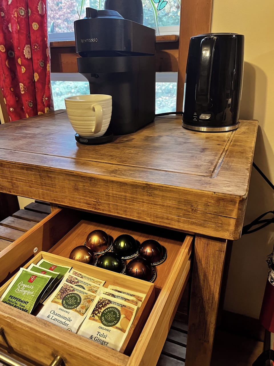 Organic herbal teas and Nespresso coffee pods provided. 