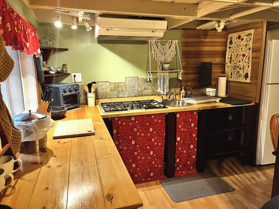 Spacious kitchen with all the amenities needed to enjoy meals during your stay.
