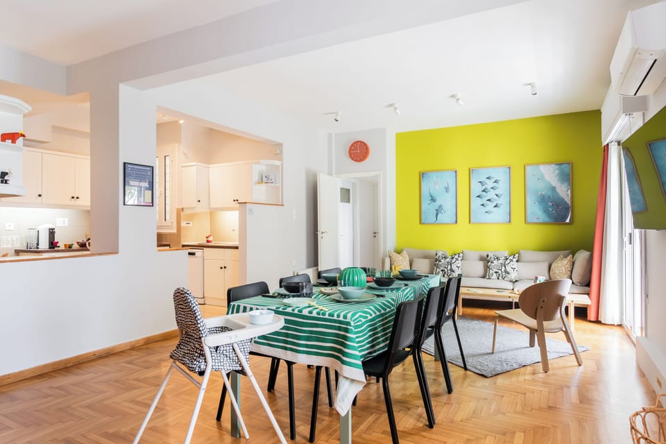 Six-person dining area with a view toward the semi-open kitchen.