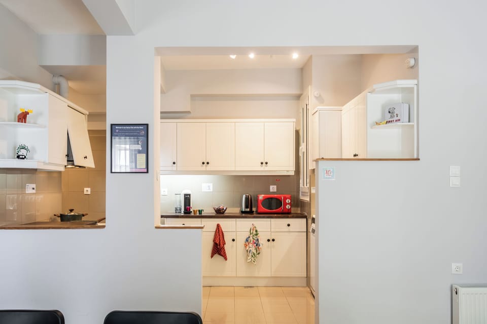 View from the six-person dining table toward the semi-open kitchen.
