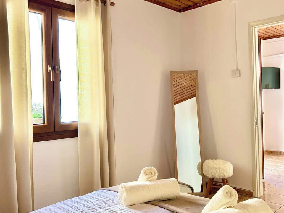 A full-length mirror with a comfortable stool, perfect for doing your hair or makeup. A bright, convenient corner to get ready and feel at home.