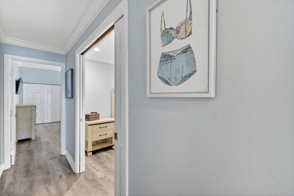 Clean, light-filled hallway leading to bedrooms, creating a calm flow through the home.