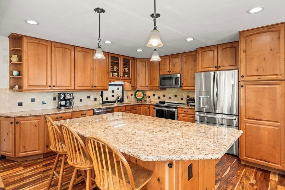 Fully equipped kitchen with large island and bar seating