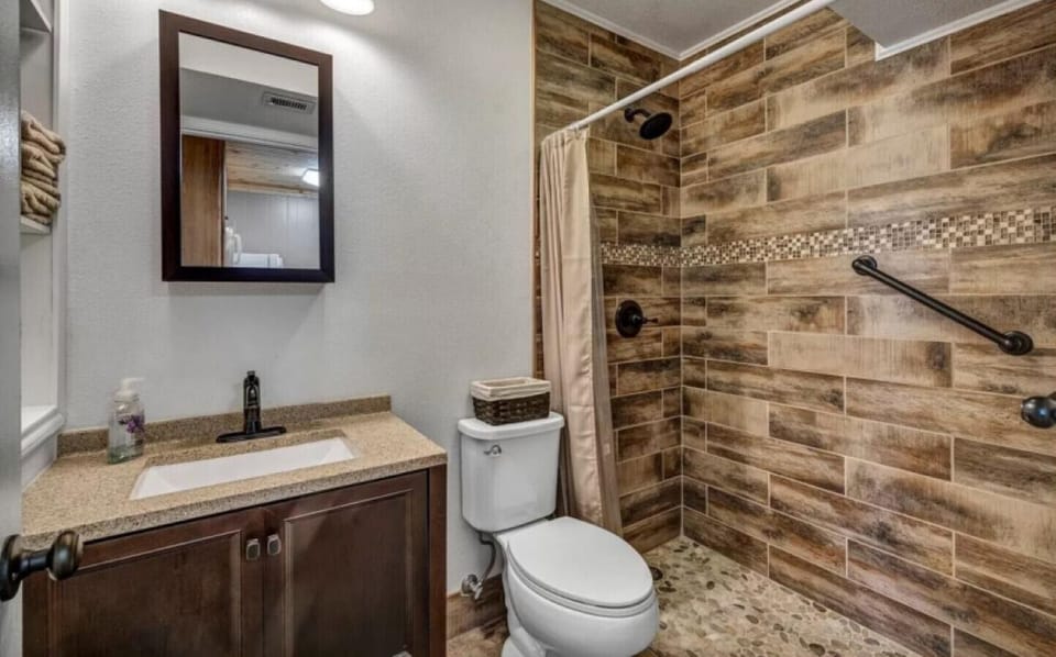 Bright bathroom with shower — perfect for refreshing after lake adventures