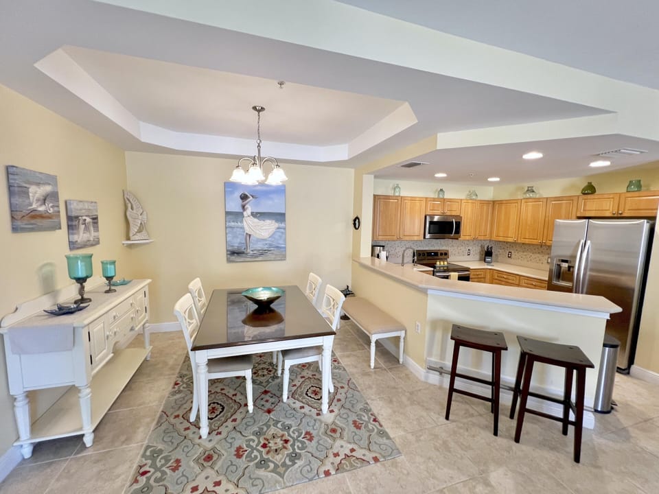 Bright open kitchen and dining area with cozy seating