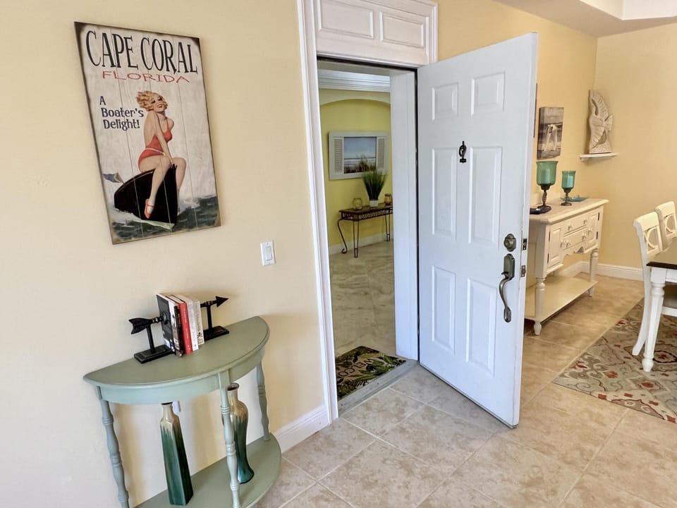 Cozy entryway with charming vintage accents and warm lighting