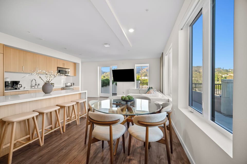 Beautiful glass dining table with chic seating for four to six guests