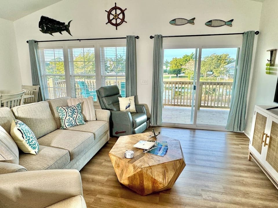 Get cozy while you relax in this living room with a water view. Sofa bed features a Queen mattress. 