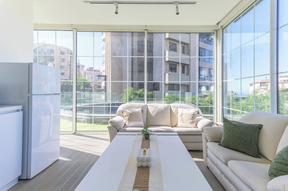 Apartment, 2 Bedrooms, Kitchenette, City View | Living room | 65-inch Smart TV with cable channels, streaming services