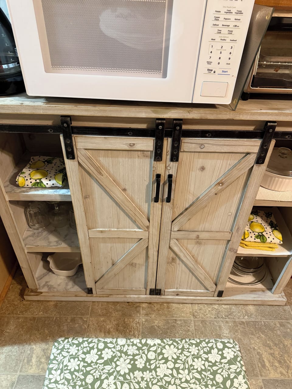 Coffee and storage area with rustic cabinet and guest essentials