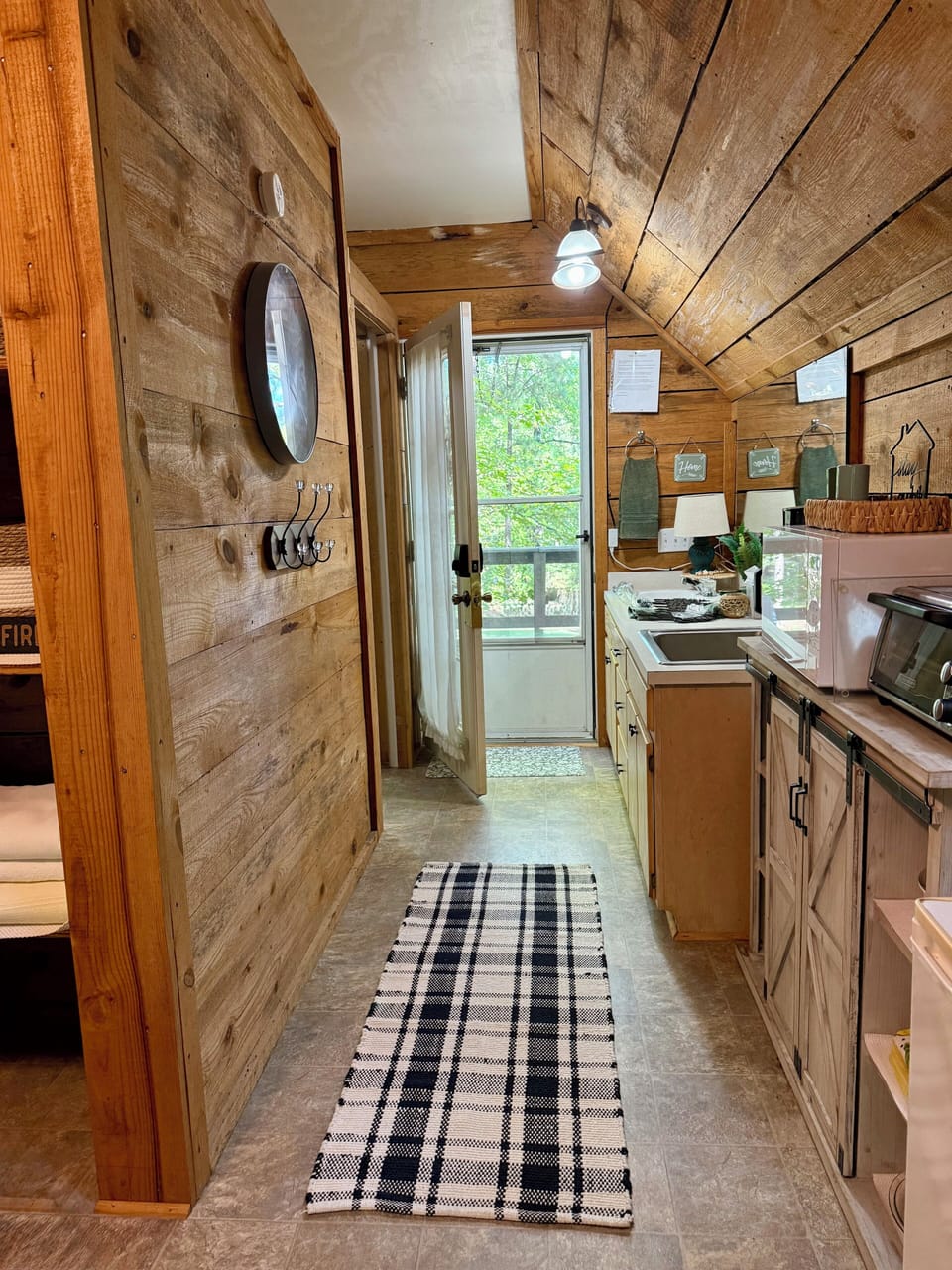 Convenient kitchenette with sink, microwave, and coffee setup