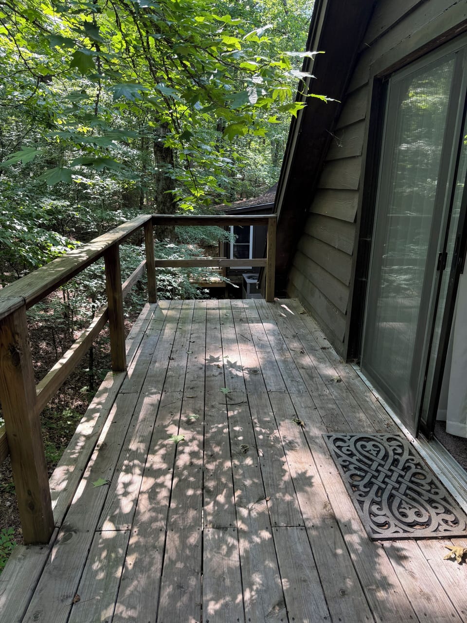 Private deck overlooking the peaceful wooded surroundings