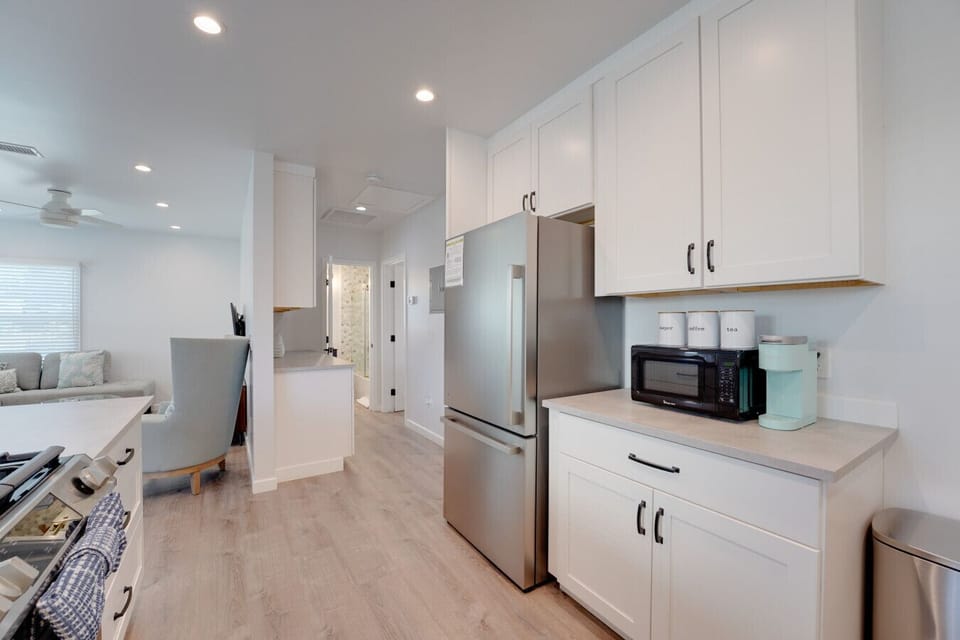 The kitchen has full size stainless steel appliances and everything you need to prepare a meal at home!