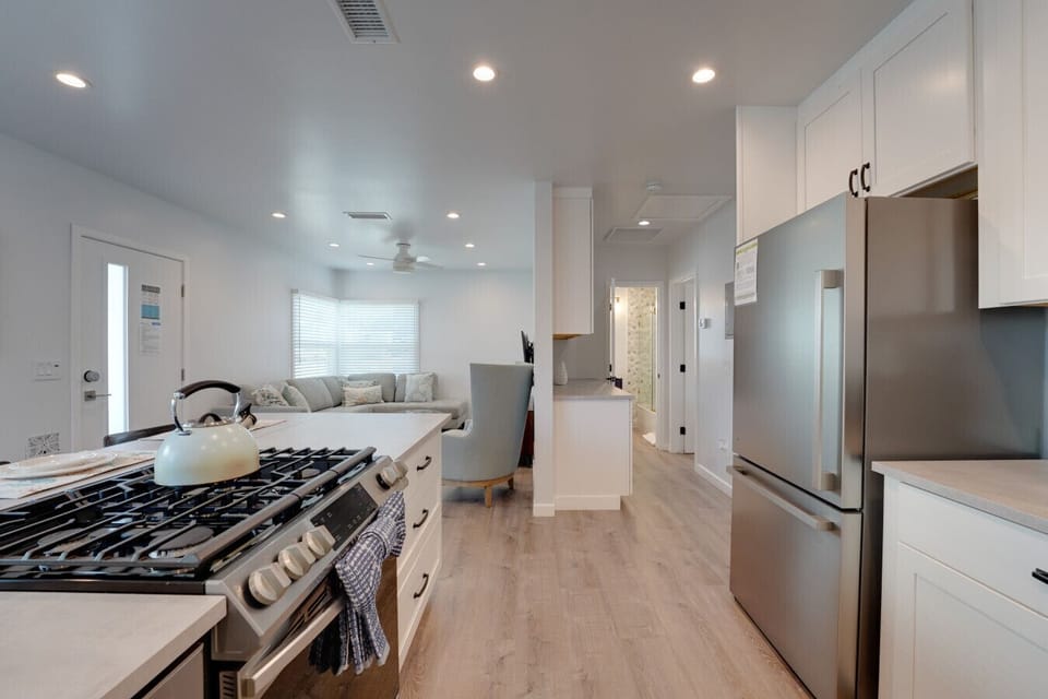 The kitchen has full size stainless steel appliances