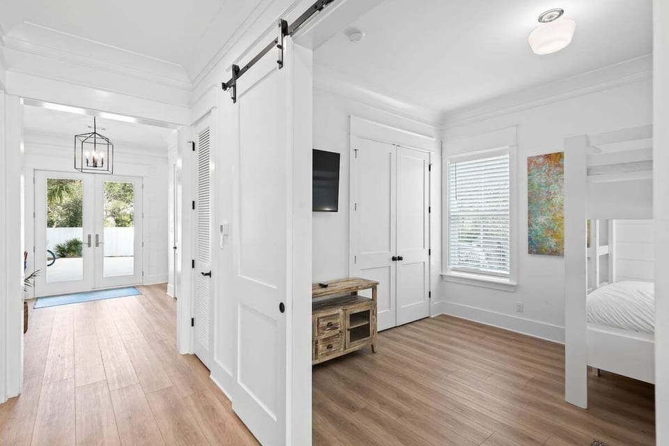 1st floor bunk room with built-in full over full and twin over twin bunks and barn doors