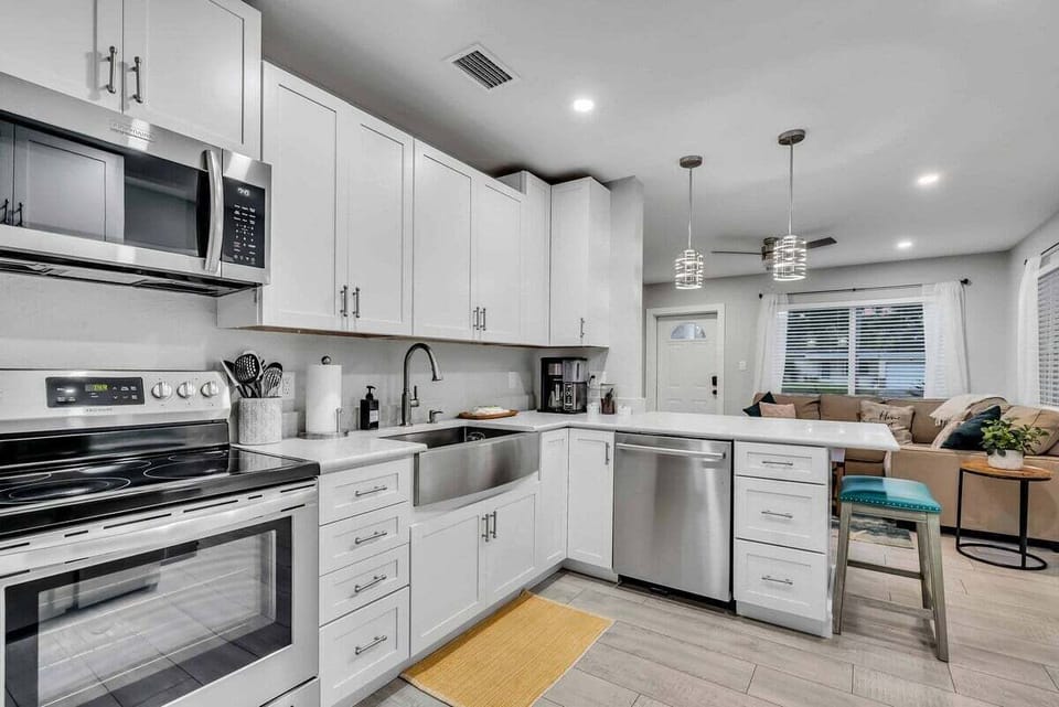 A full-size kitchen equipped with cooking utensils and modern appliances so you can enjoy your favorite meals even on vacation!