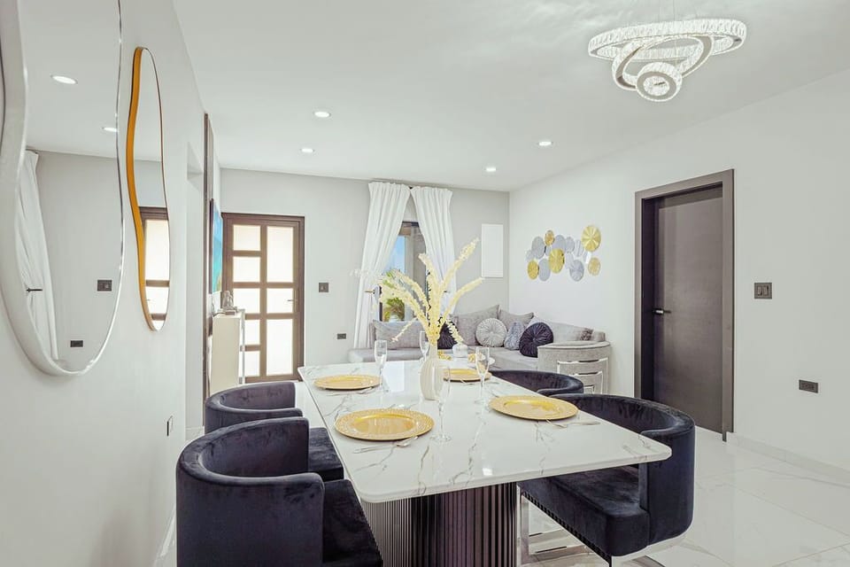 Gather around the dining table and share meals together in a cozy, open setting.