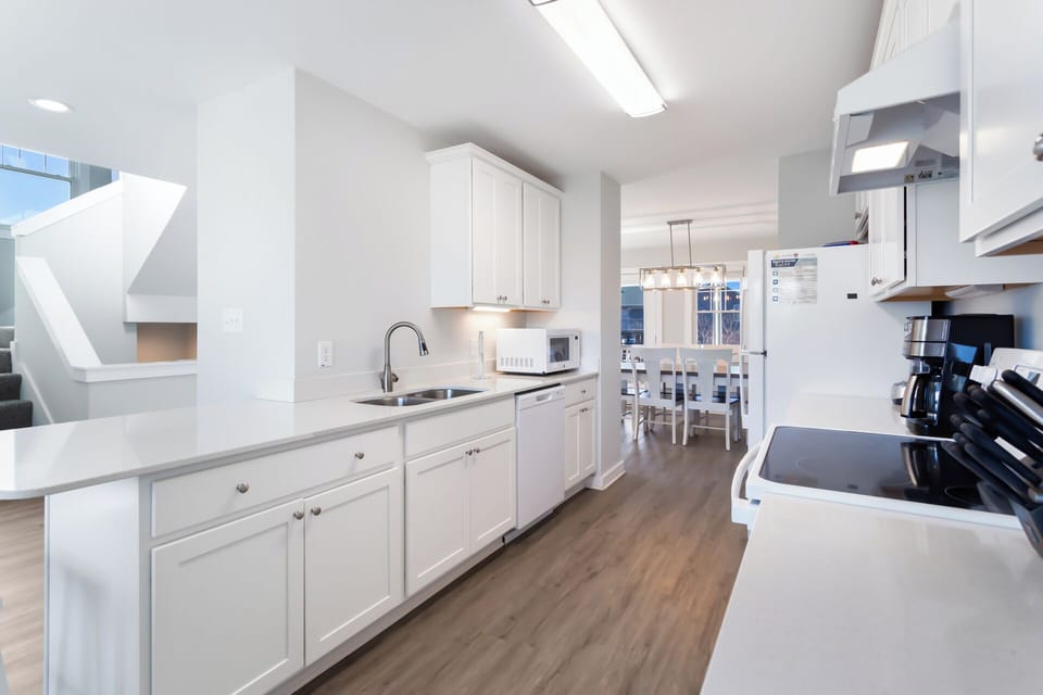 Kitchen: Well-appointed kitchen with full-size appliances, cookware, and ample counter space.