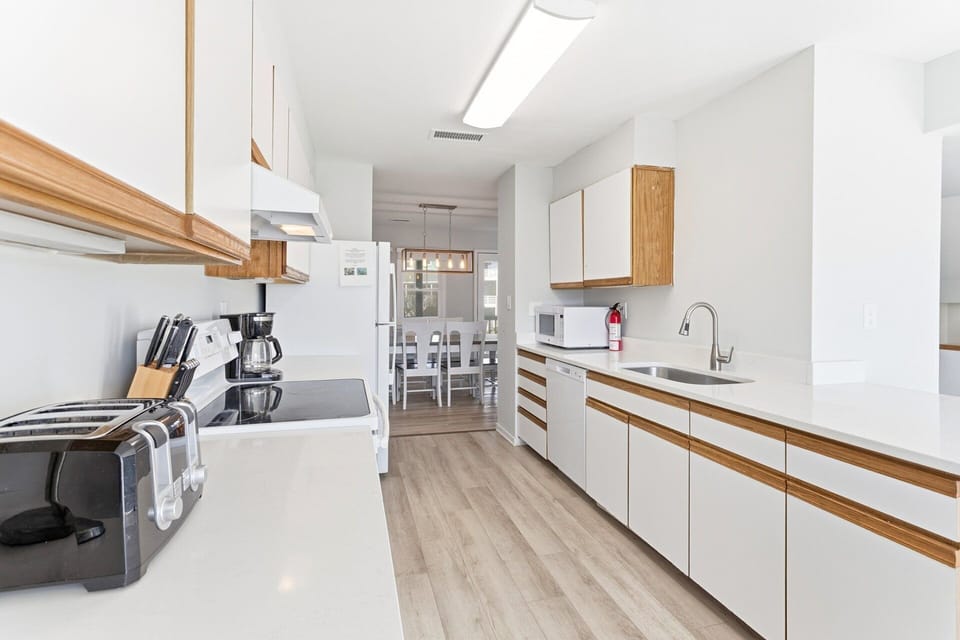 Kitchen — Well-appointed kitchen with full-size appliances, cookware, and ample counter space.