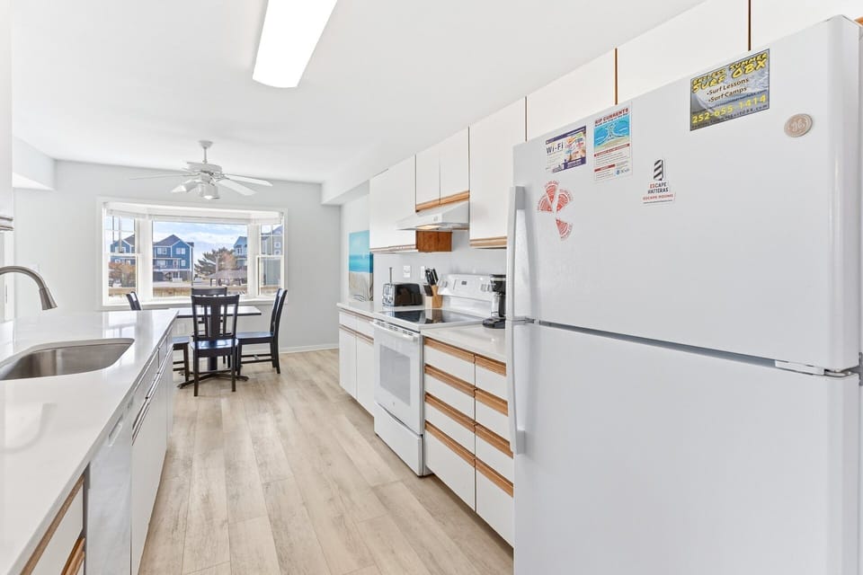 Kitchen — Well-appointed kitchen with full-size appliances, cookware, and ample counter space.