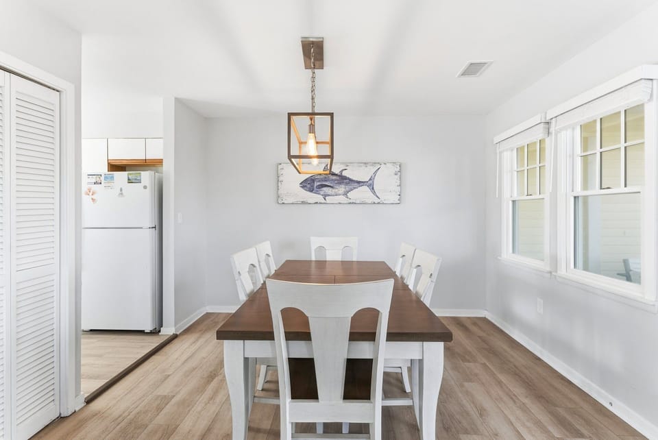 Dining Area — Dining table designed for shared meals, family game nights, or board games, with flexibility to double as a remote work space.