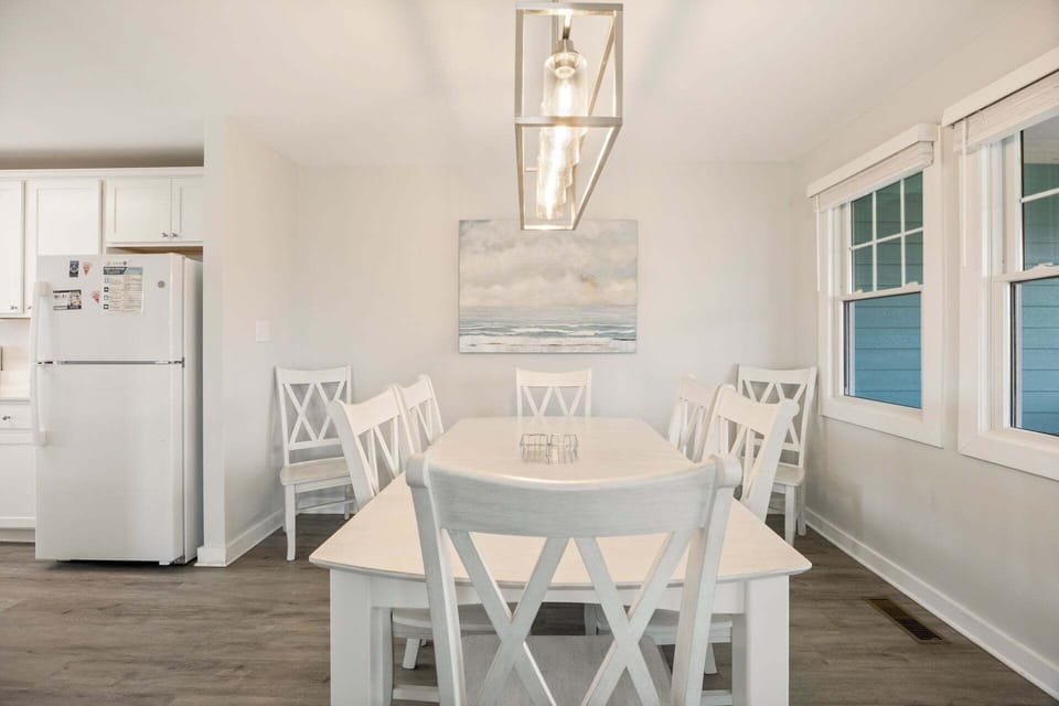 Dining Area: Dining table designed for shared meals, family game nights, or board games, with flexibility to double as a remote work space.