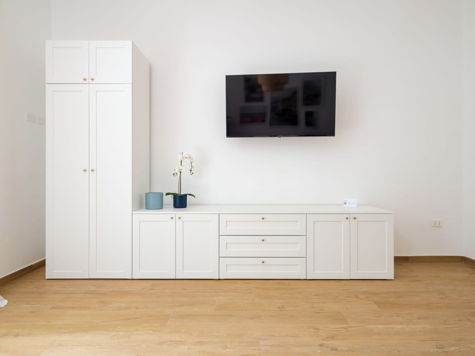 Design Apartment, Garden View | Living area | 50-inch Smart TV with digital channels, Netflix, streaming services