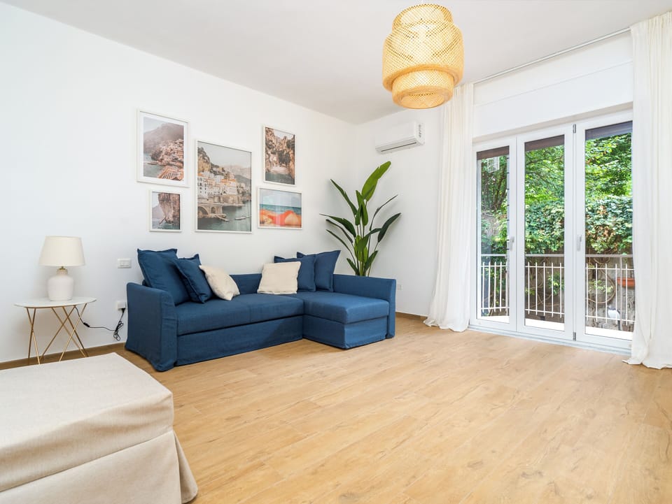 Design Apartment, Garden View | Living area | 50-inch Smart TV with digital channels, Netflix, streaming services