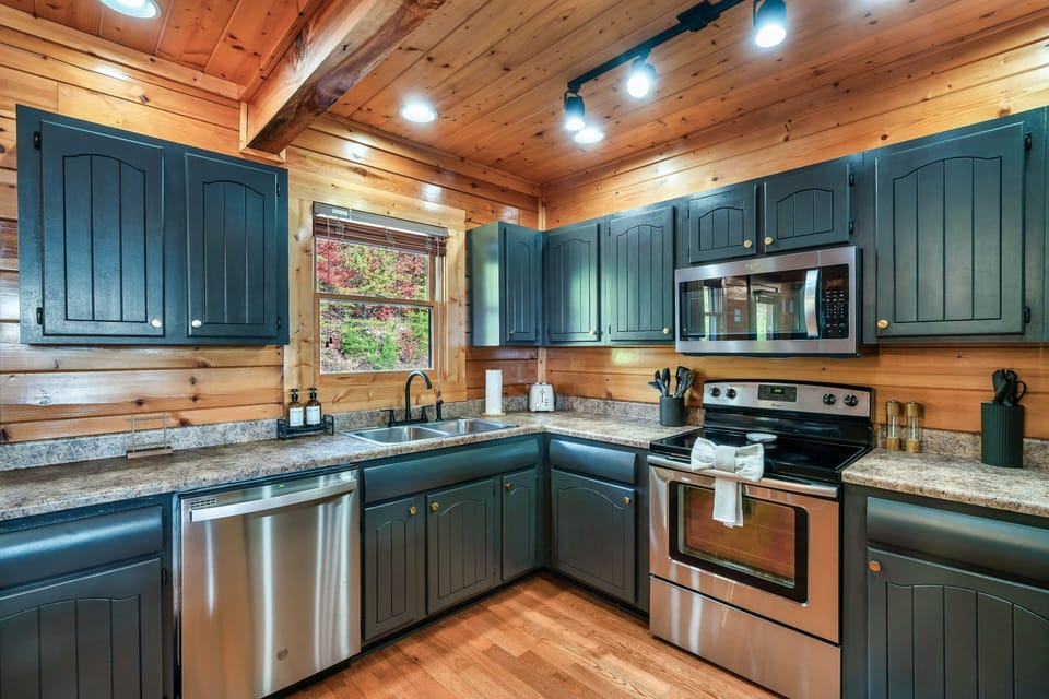 Fully equipped kitchen with modern appliances.