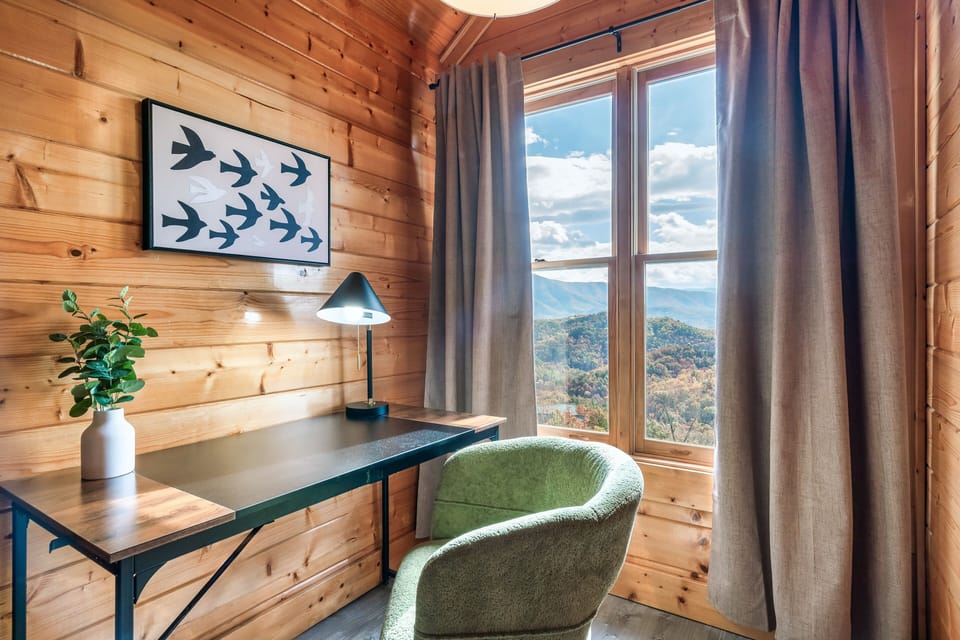 Workspace with stunning mountain view for remote working or journaling sessions.