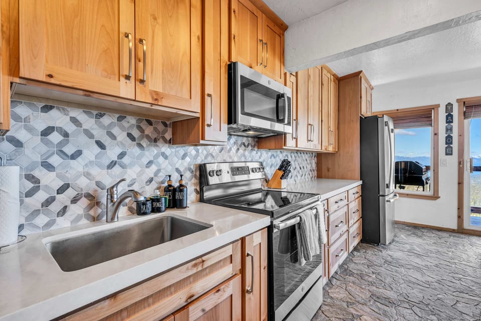 Kitchen: Main floor, drip coffee maker, blender, cooking utensils, tableware